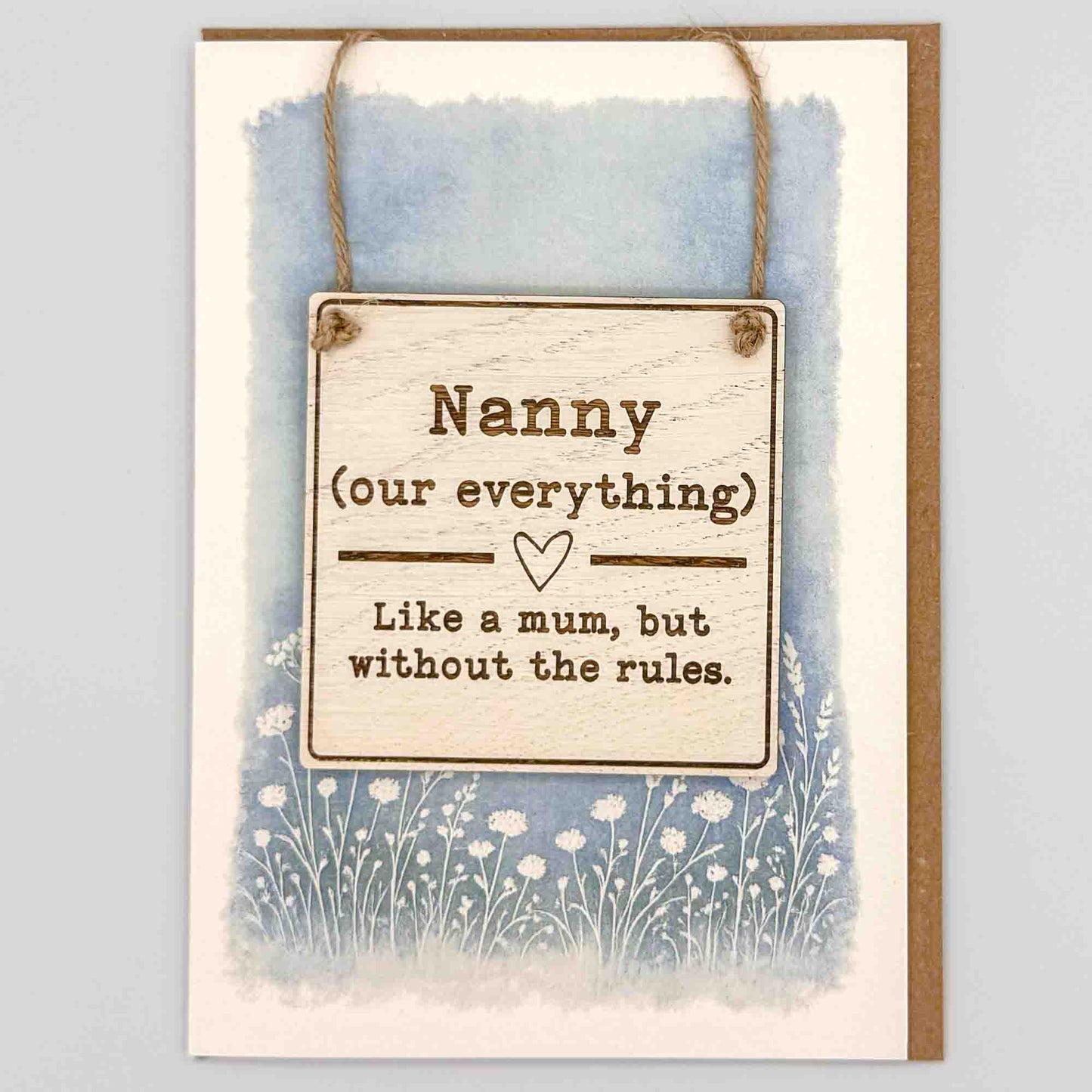 Nanny our everything square keepsake card from Sprinkled with Magic, featuring a removable wooden Nanny sign, blue botanical design and recycled kraft envelope.