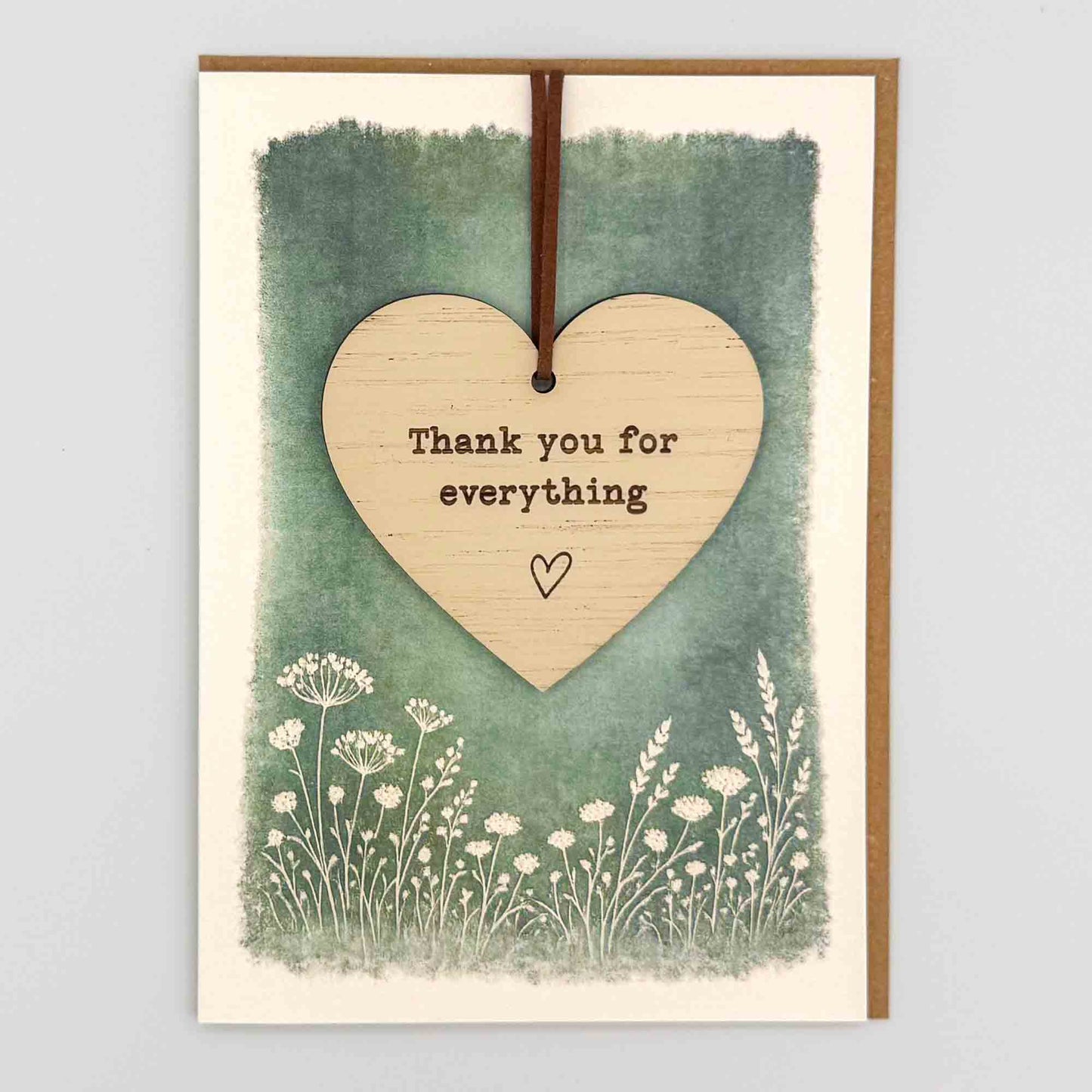 Thank you for everything heart keepsake card from Sprinkled with Magic, featuring a removable wooden heart keepsake, green botanical design and recycled kraft envelope.