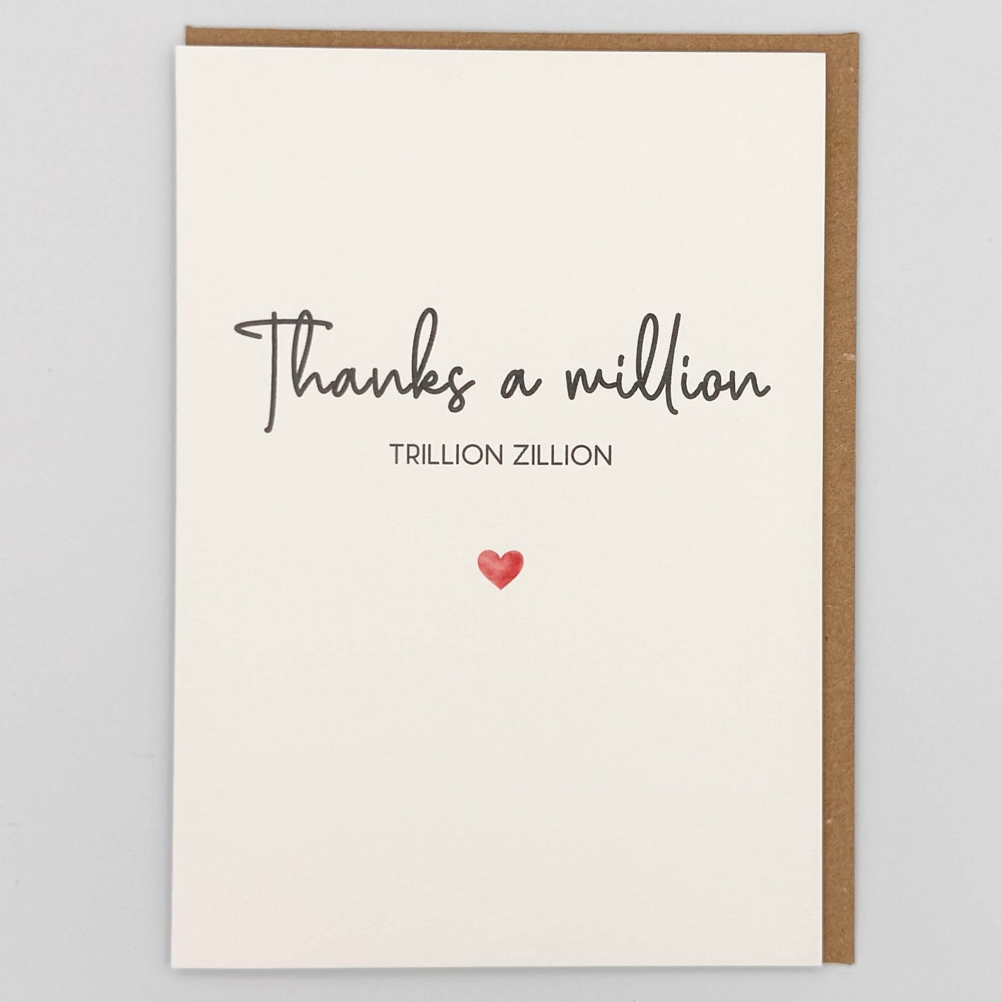 Thanks a million card from Sprinkled with Magic, featuring handwritten-style thank you wording, a small red heart and recycled kraft envelope.