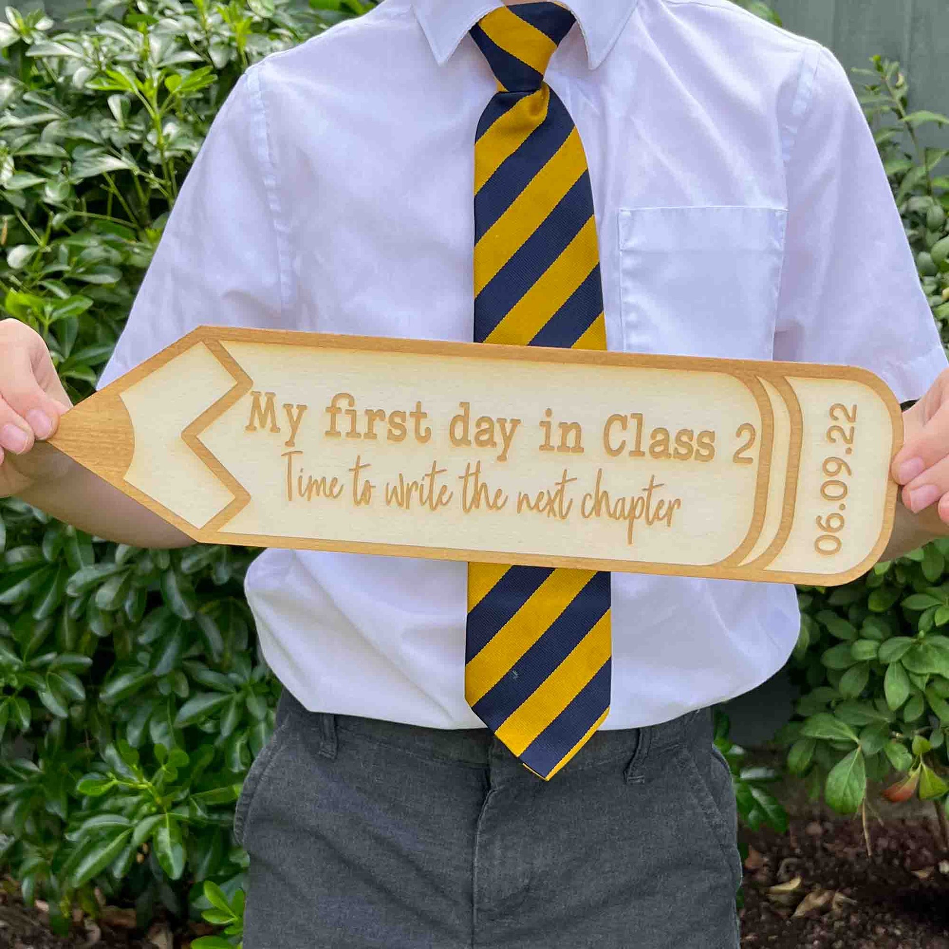personalised back to school photo prop with school year in shape of a pencil.
