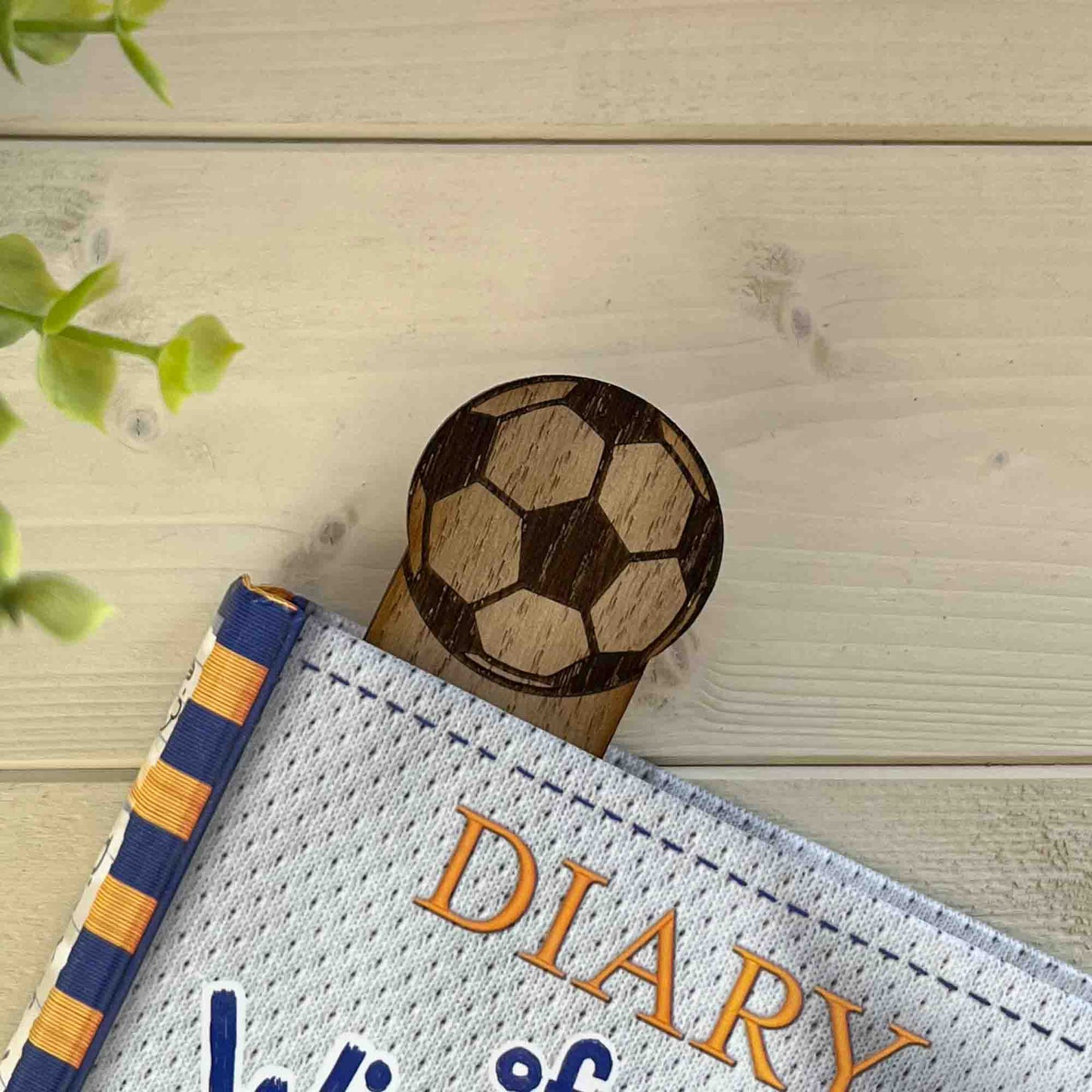 football bookmark in a book with just the top sticking out