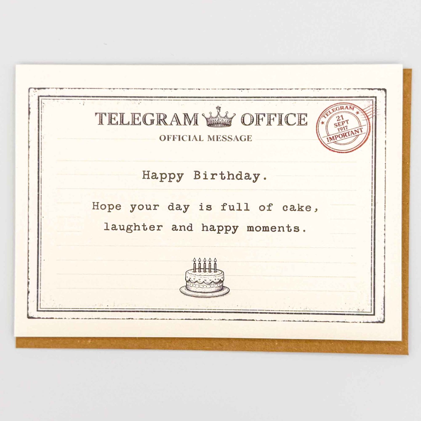 Happy birthday cake telegram card from Sprinkled with Magic, featuring vintage telegram-style wording, small birthday cake detail and recycled kraft envelope.