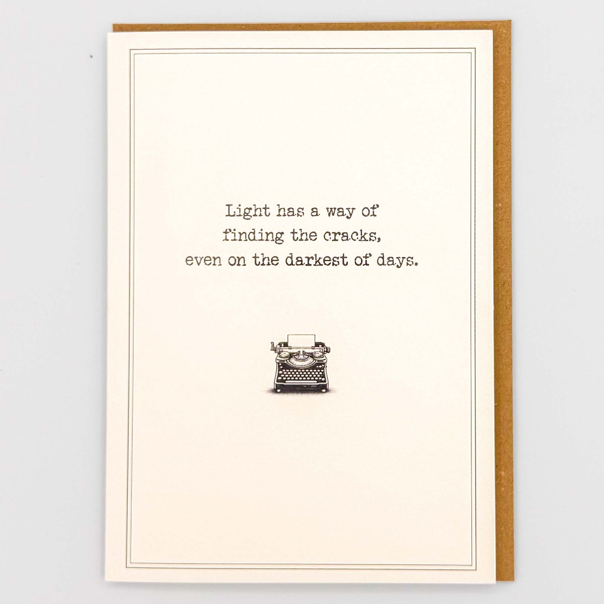 Light has a way typewriter card from Sprinkled with Magic, featuring hopeful wording, a vintage typewriter illustration and recycled kraft envelope.