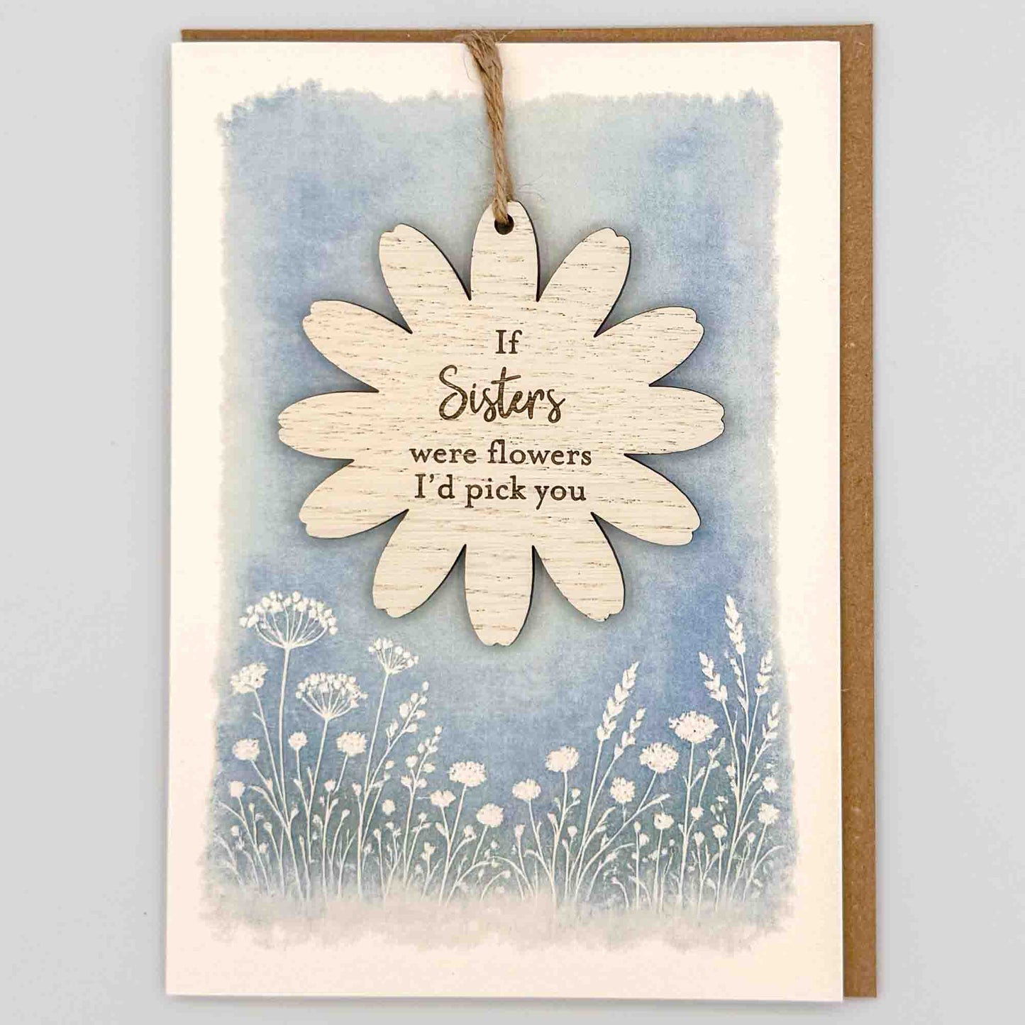 If sisters were flowers keepsake card from Sprinkled with Magic, featuring a removable wooden flower keepsake, blue botanical design and recycled kraft envelope.