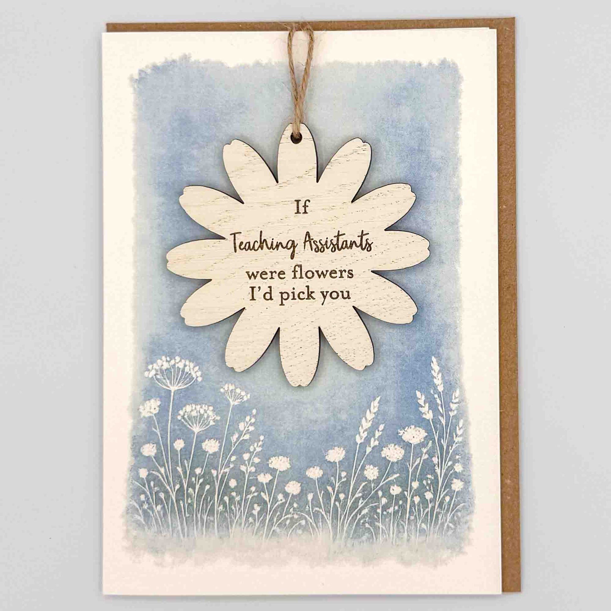 If teaching assistants were flowers keepsake card from Sprinkled with Magic, featuring a removable wooden flower keepsake, blue botanical design and recycled kraft envelope.