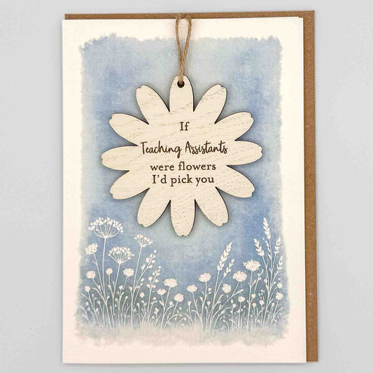 If teaching assistants were flowers keepsake card from Sprinkled with Magic, featuring a removable wooden flower keepsake, blue botanical design and recycled kraft envelope.