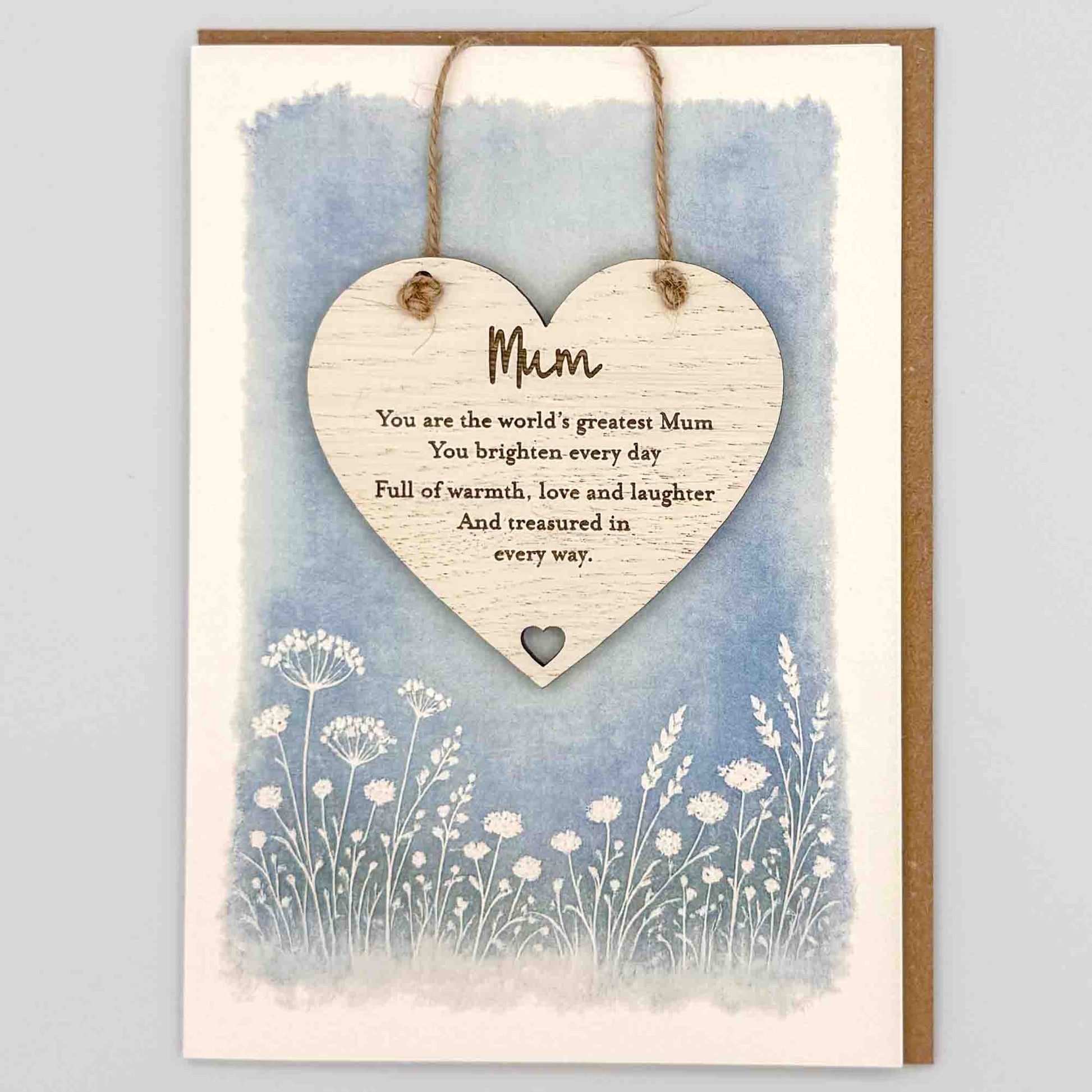 World’s greatest Mum heart keepsake card from Sprinkled with Magic, featuring a removable wooden heart keepsake, blue botanical design and recycled kraft envelope.