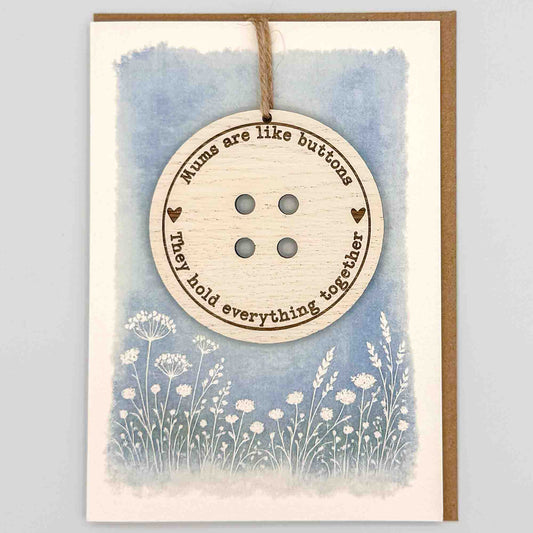 Mums are like buttons keepsake card from Sprinkled with Magic, featuring a removable wooden button keepsake, blue botanical design and recycled kraft envelope.