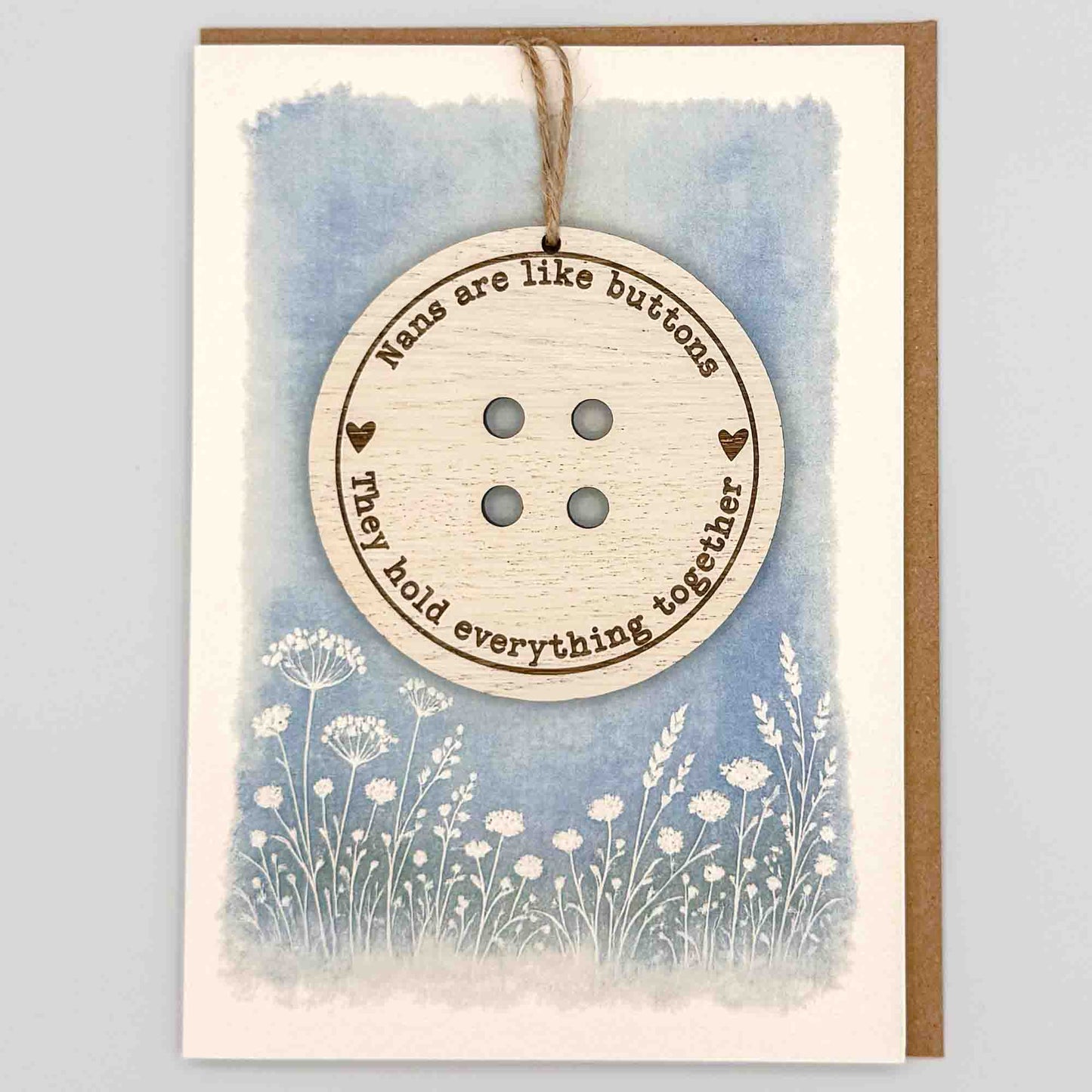 Nans are like buttons keepsake card from Sprinkled with Magic, featuring a removable wooden button keepsake, blue botanical design and recycled kraft envelope.