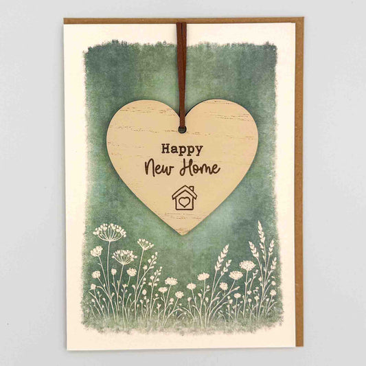 Happy new home heart keepsake card from Sprinkled with Magic, featuring a removable wooden heart keepsake, green botanical design and recycled kraft envelope.