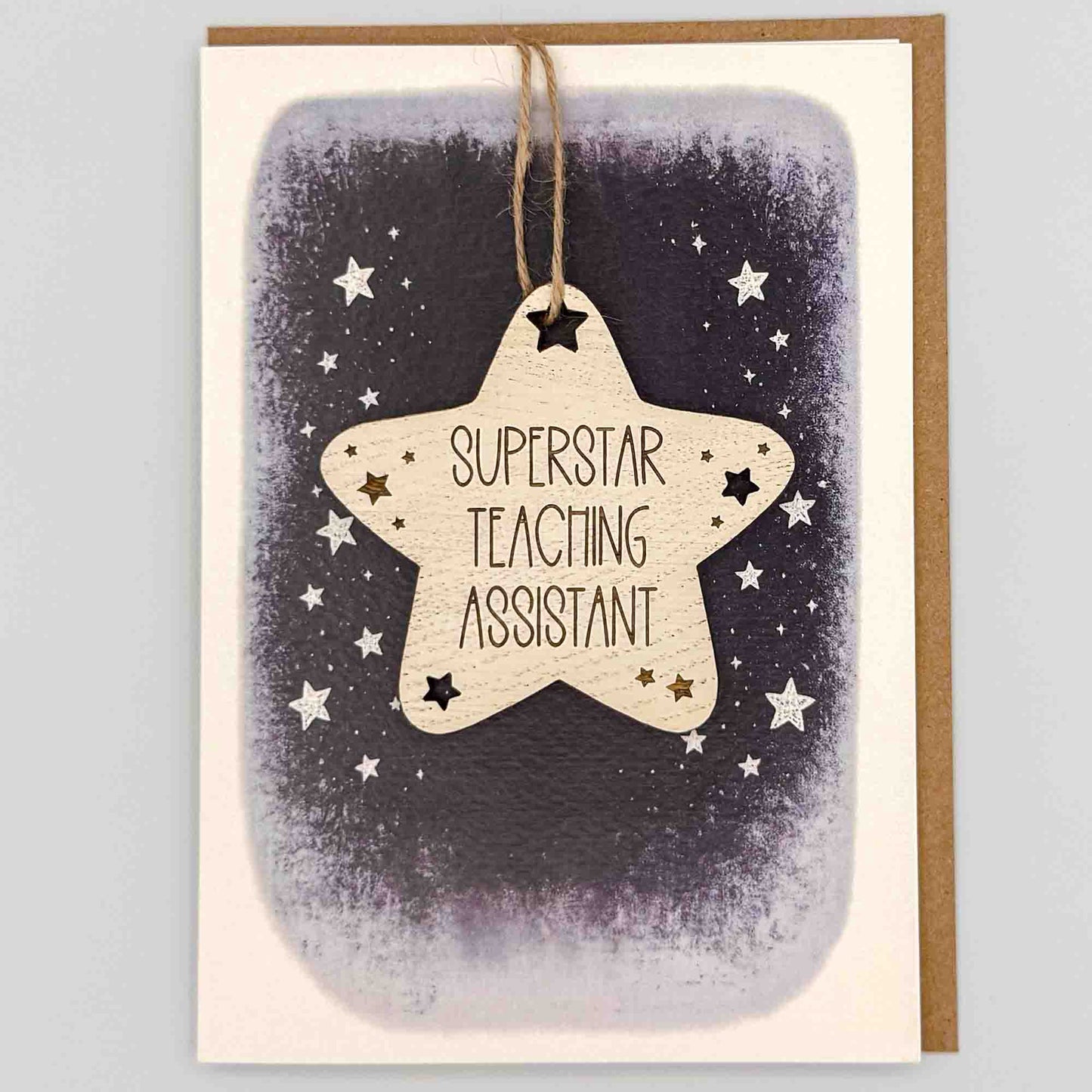 Superstar teaching assistant star keepsake card from Sprinkled with Magic, featuring a removable wooden star keepsake, starry navy design and recycled kraft envelope.