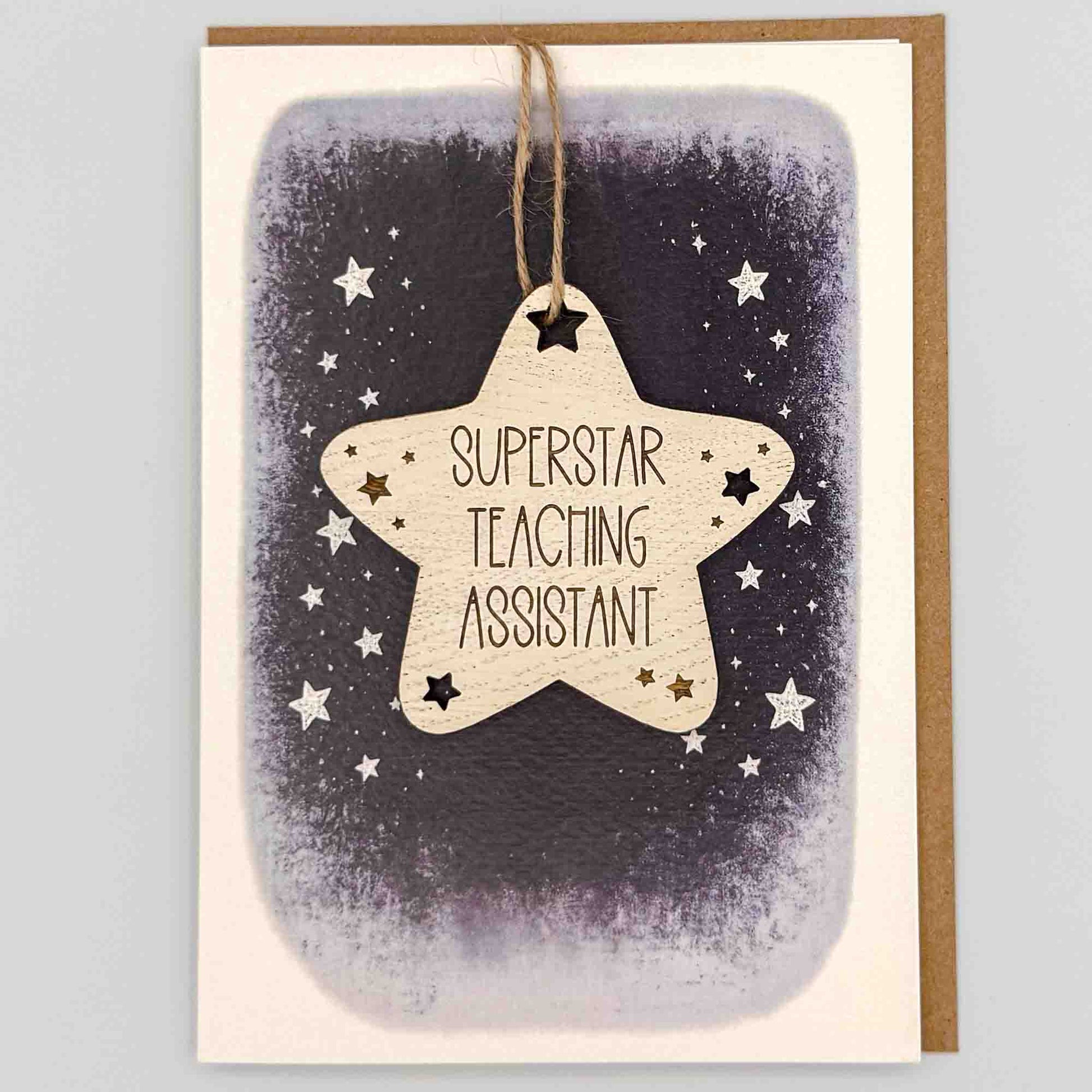 Superstar teaching assistant star keepsake card from Sprinkled with Magic, featuring a removable wooden star keepsake, starry navy design and recycled kraft envelope.