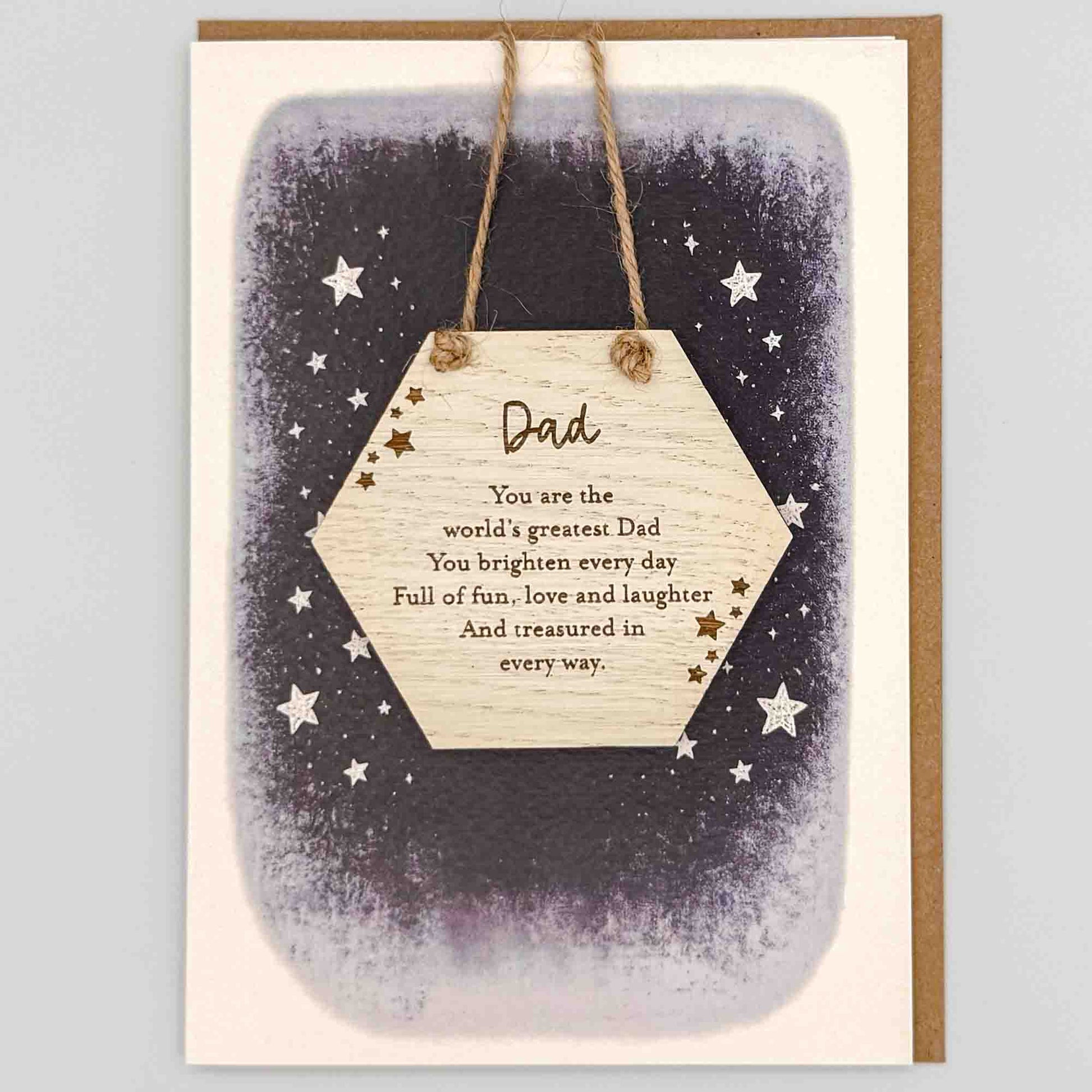 World’s greatest Dad hexagon keepsake card from Sprinkled with Magic, featuring a removable wooden hexagon keepsake, starry navy design and recycled kraft envelope.