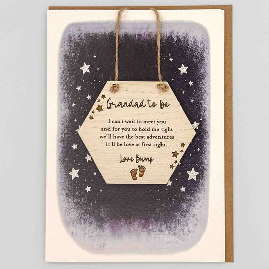 Grandad to be love bump hexagon keepsake card from Sprinkled with Magic, featuring a removable wooden hexagon keepsake, baby feet detail, starry navy design and recycled kraft envelope.