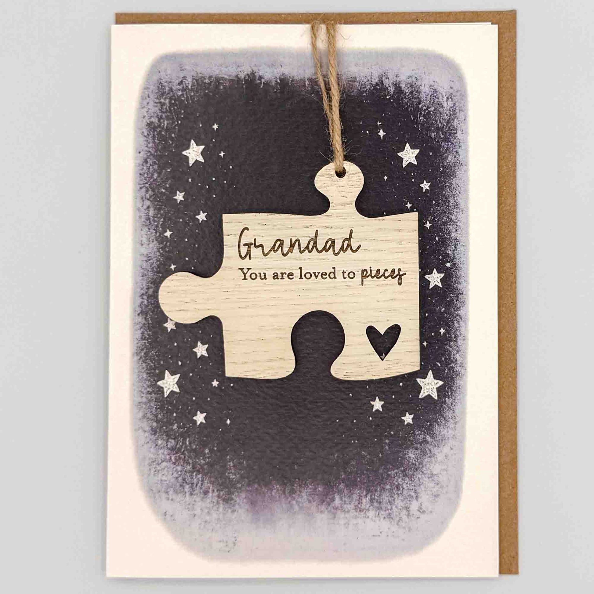 Grandad loved to pieces jigsaw keepsake card from Sprinkled with Magic, featuring a removable wooden jigsaw keepsake, starry navy design and recycled kraft envelope.
