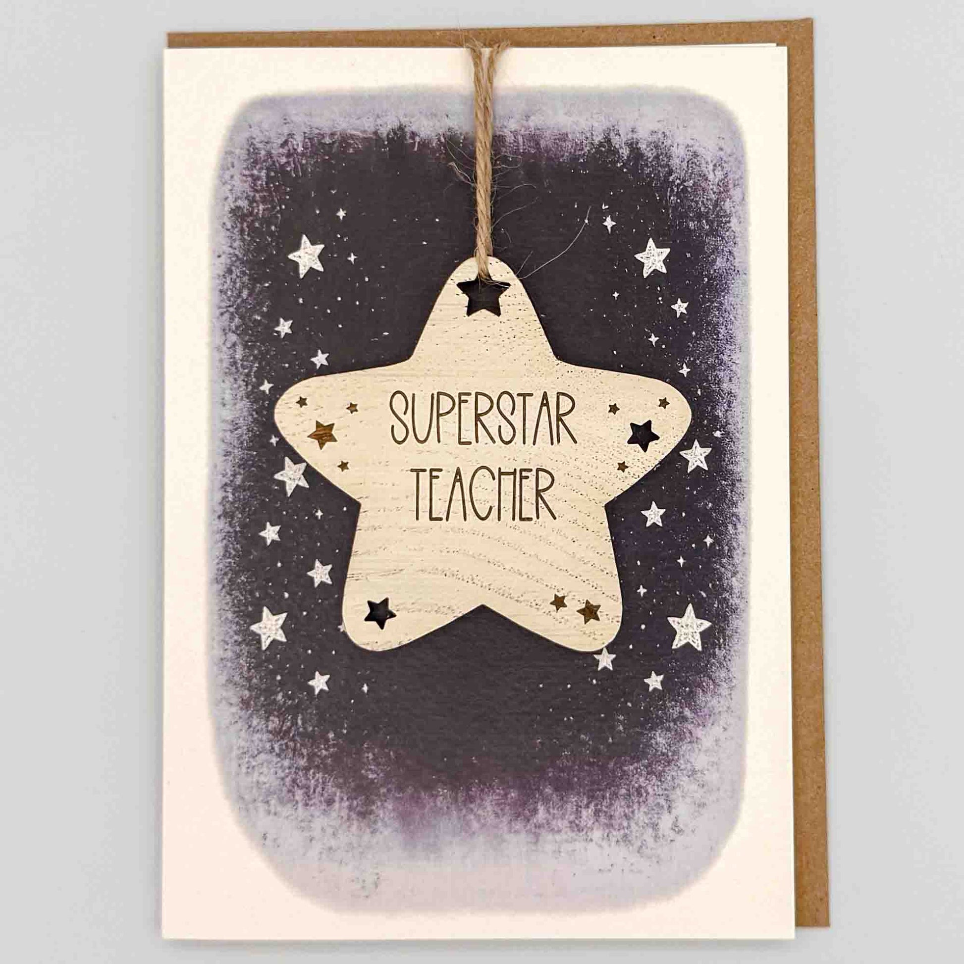 Superstar teacher star keepsake card from Sprinkled with Magic, featuring a removable wooden star keepsake, starry navy design and recycled kraft envelope.