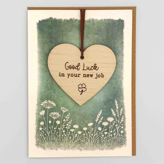 Good luck new job clover heart keepsake card from Sprinkled with Magic, featuring a removable wooden heart keepsake, clover icon, green botanical design and recycled kraft envelope.