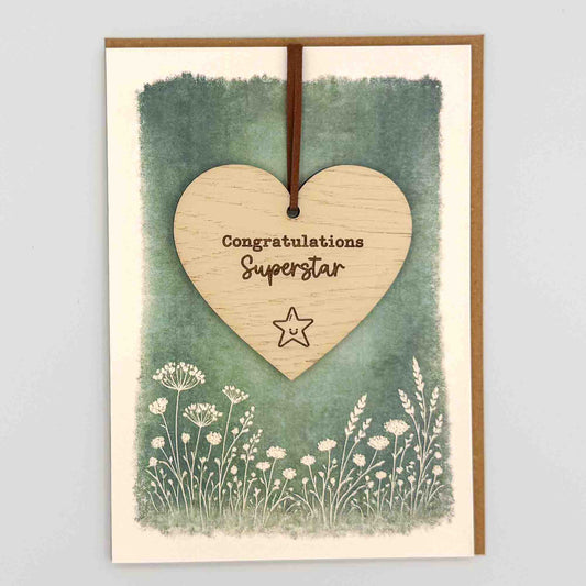 Congratulations superstar star heart keepsake card from Sprinkled with Magic, featuring a removable wooden heart keepsake, small star detail, green botanical design and recycled kraft envelope.