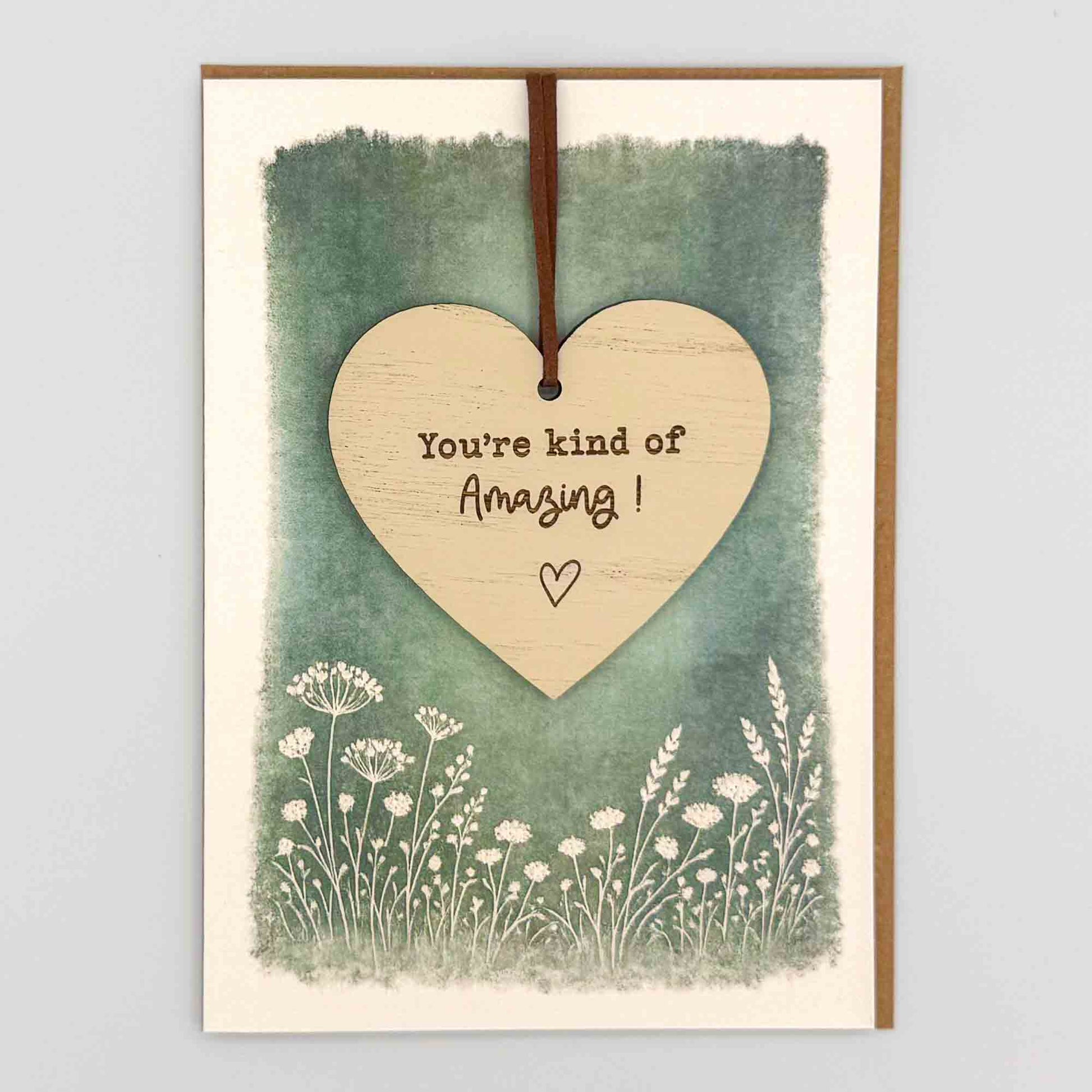 You’re kind of amazing heart keepsake card from Sprinkled with Magic, featuring a removable wooden heart keepsake, green botanical design and recycled kraft envelope.