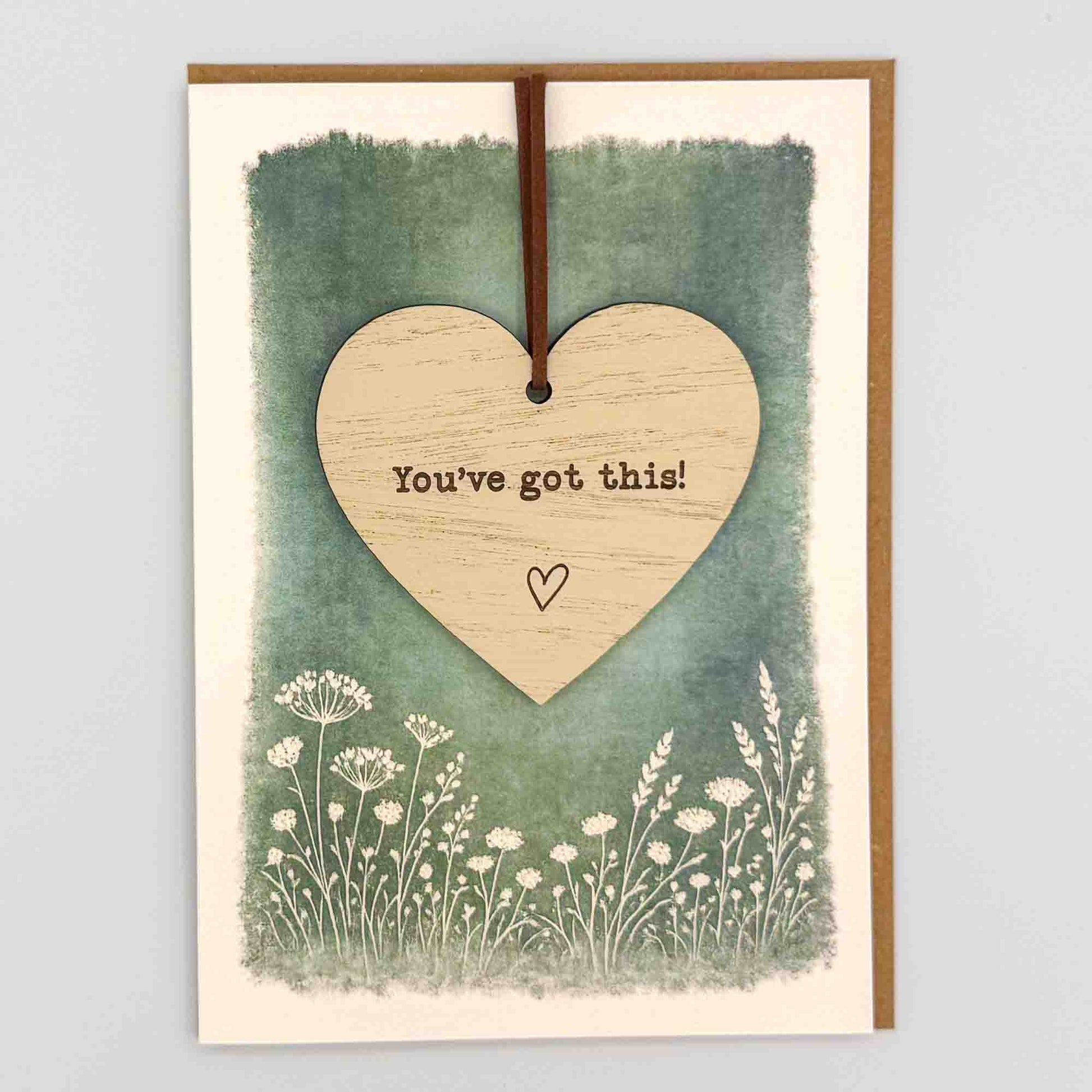 You’ve got this heart keepsake card from Sprinkled with Magic, featuring a removable wooden heart keepsake, green botanical design and recycled kraft envelope.