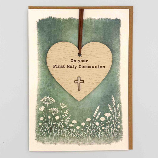 First Holy Communion heart keepsake card from Sprinkled with Magic, featuring a removable wooden heart keepsake, cross detail, green botanical design and recycled kraft envelope.