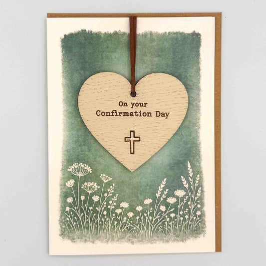 Confirmation Day heart keepsake card from Sprinkled with Magic, featuring a removable wooden heart keepsake, cross detail, green botanical design and recycled kraft envelope.
