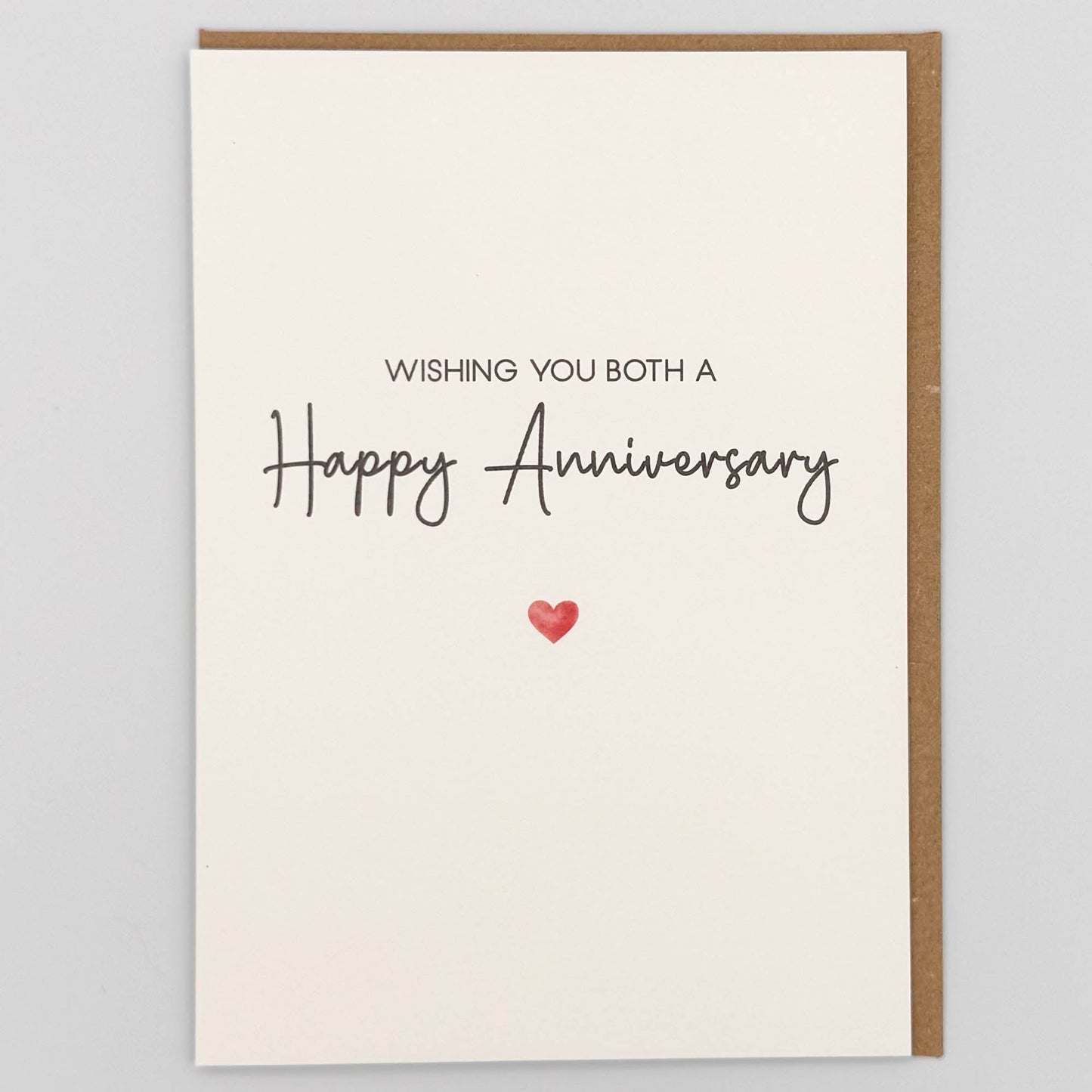 Happy anniversary card from Sprinkled with Magic, featuring handwritten-style wording, a small red heart and recycled kraft envelope.