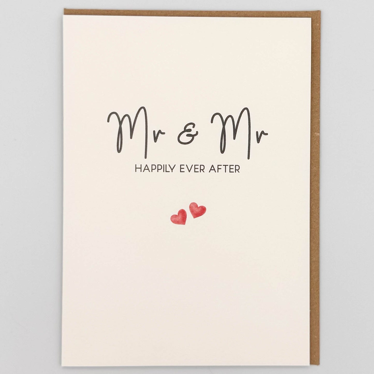 Mr and Mr wedding card from Sprinkled with Magic, featuring handwritten-style happily ever after wording, two small pink hearts and recycled kraft envelope.