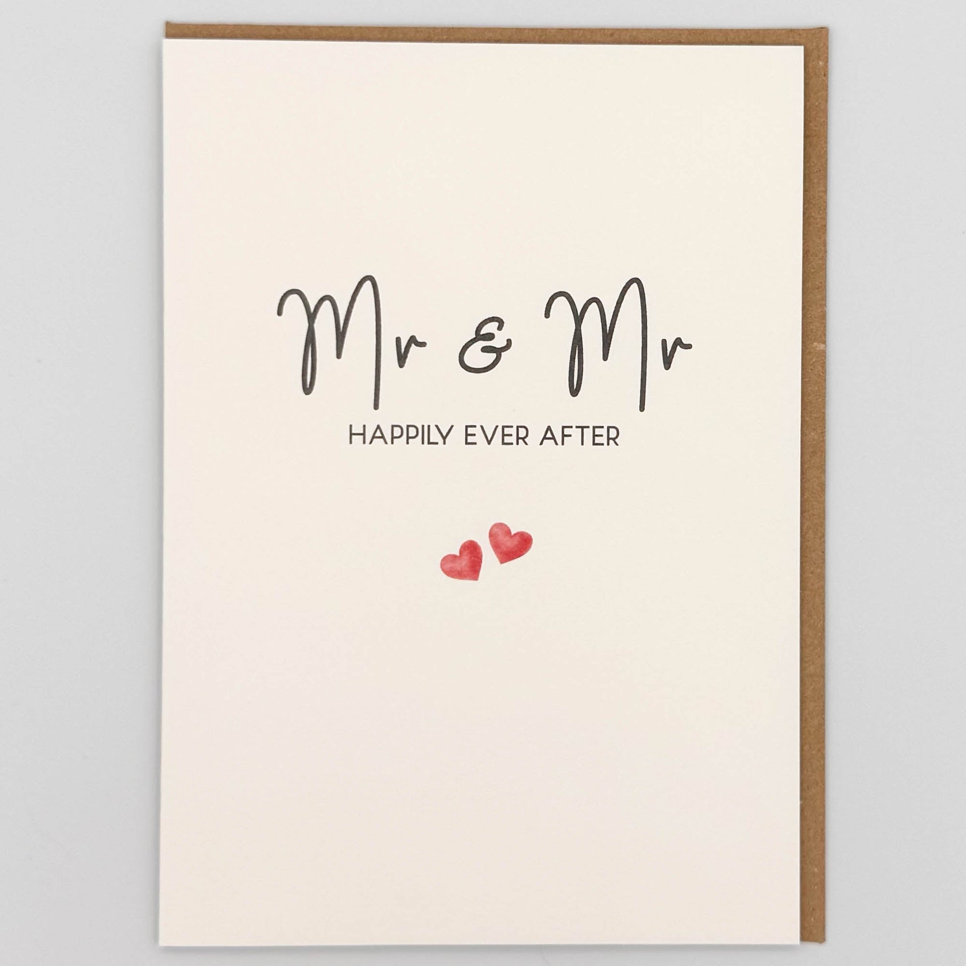 Mr and Mr wedding card from Sprinkled with Magic, featuring handwritten-style happily ever after wording, two small pink hearts and recycled kraft envelope.