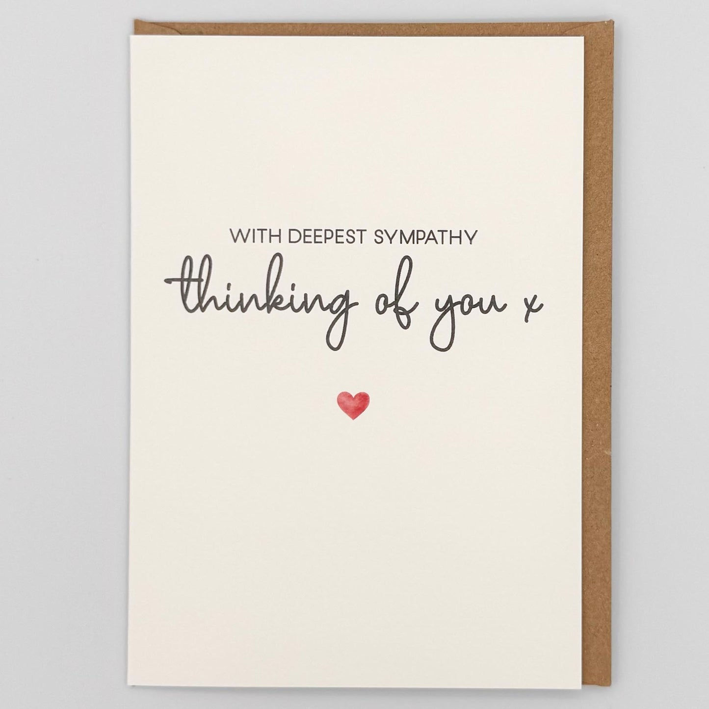 Thinking of you sympathy card from Sprinkled with Magic, featuring deepest sympathy wording, a small red heart and recycled kraft envelope.
