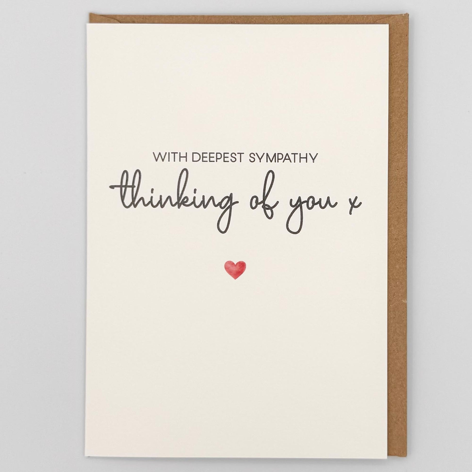 Thinking of you sympathy card from Sprinkled with Magic, featuring deepest sympathy wording, a small red heart and recycled kraft envelope.