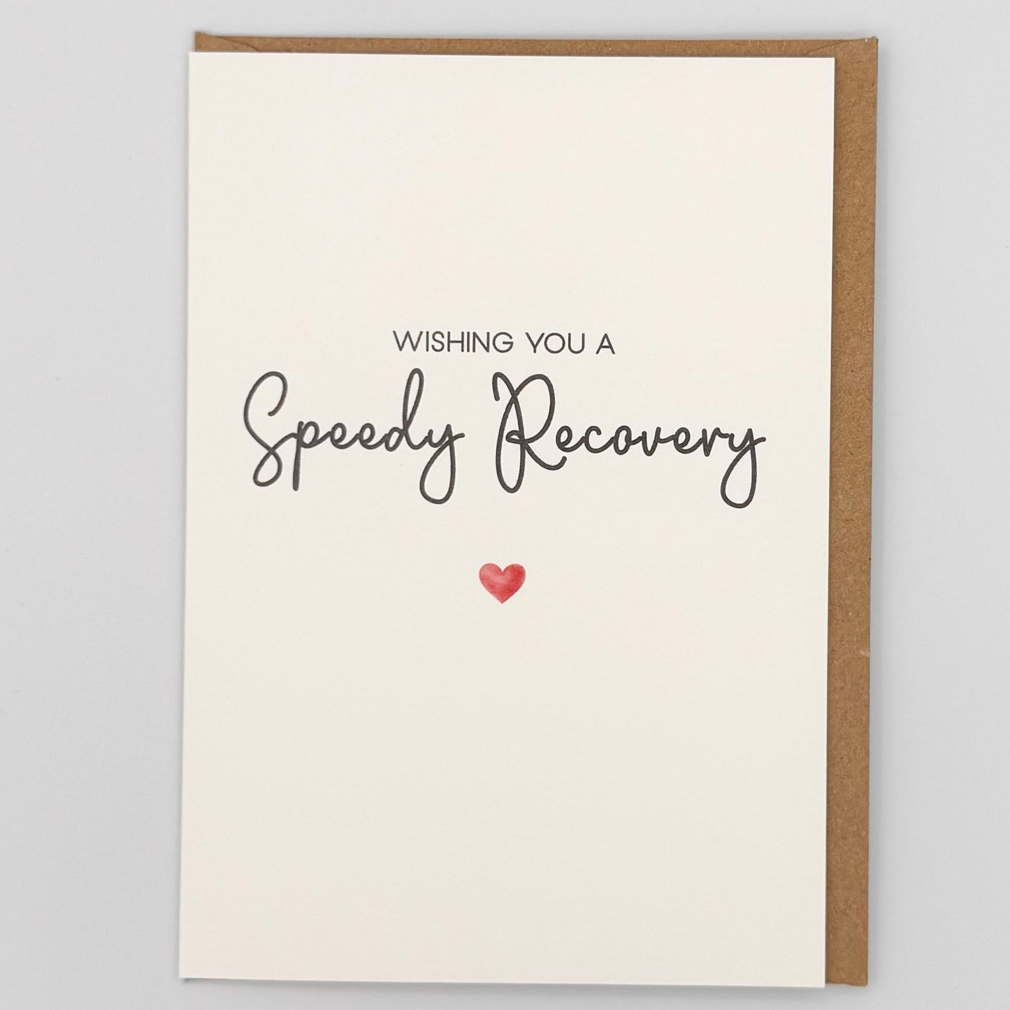 Speedy recovery card from Sprinkled with Magic, featuring handwritten-style get well wording, a small red heart and recycled kraft envelope.