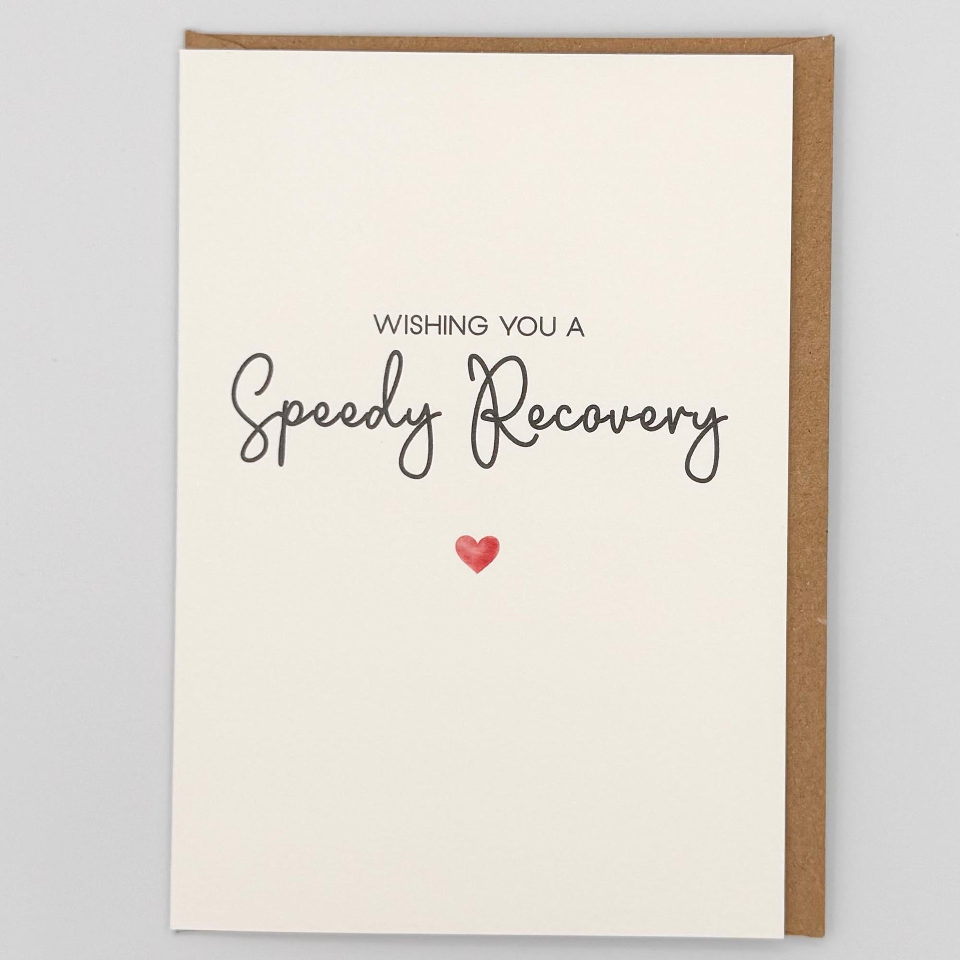 Speedy recovery card from Sprinkled with Magic, featuring handwritten-style get well wording, a small red heart and recycled kraft envelope.
