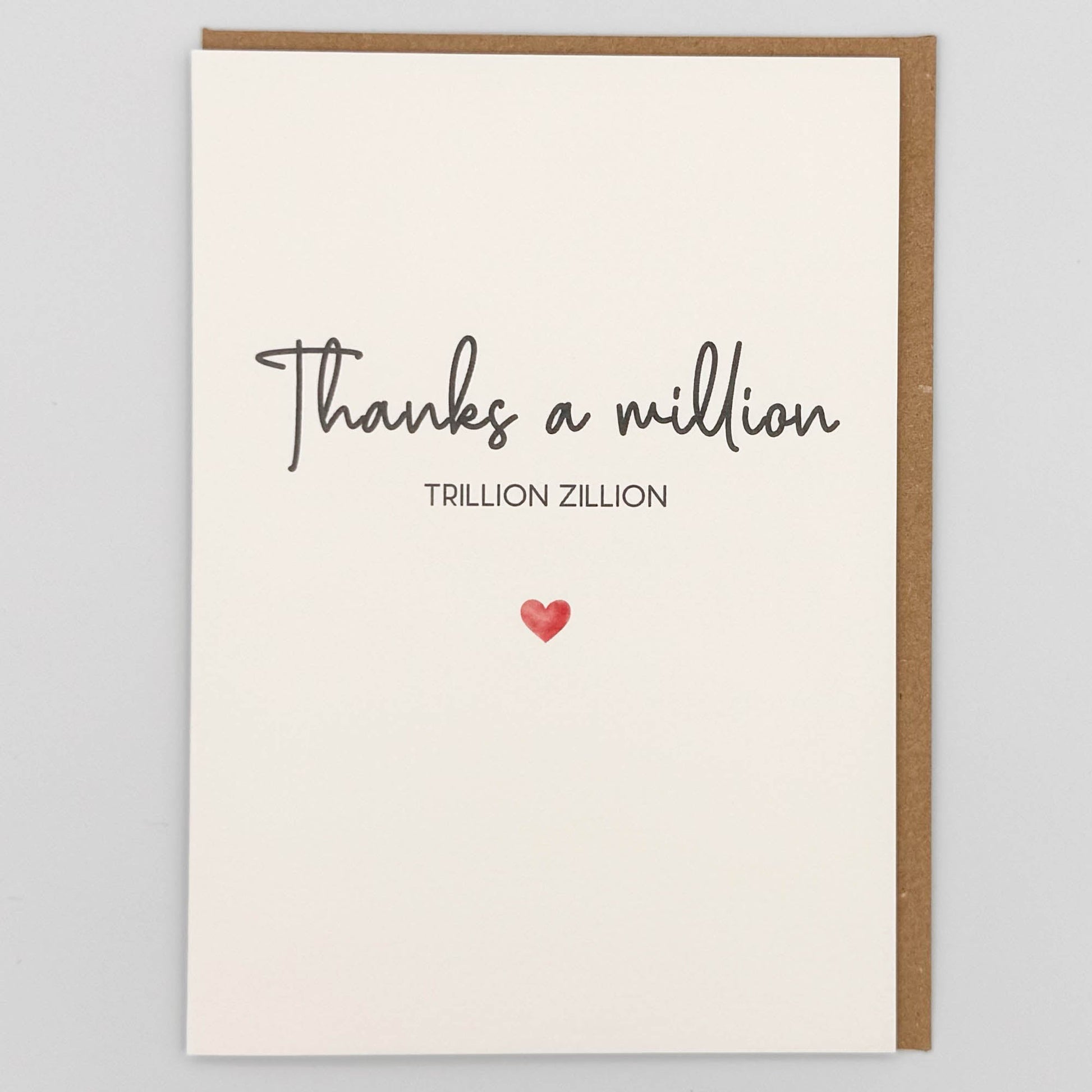 Thanks a million card from Sprinkled with Magic, featuring handwritten-style thank you wording, a small red heart and recycled kraft envelope.