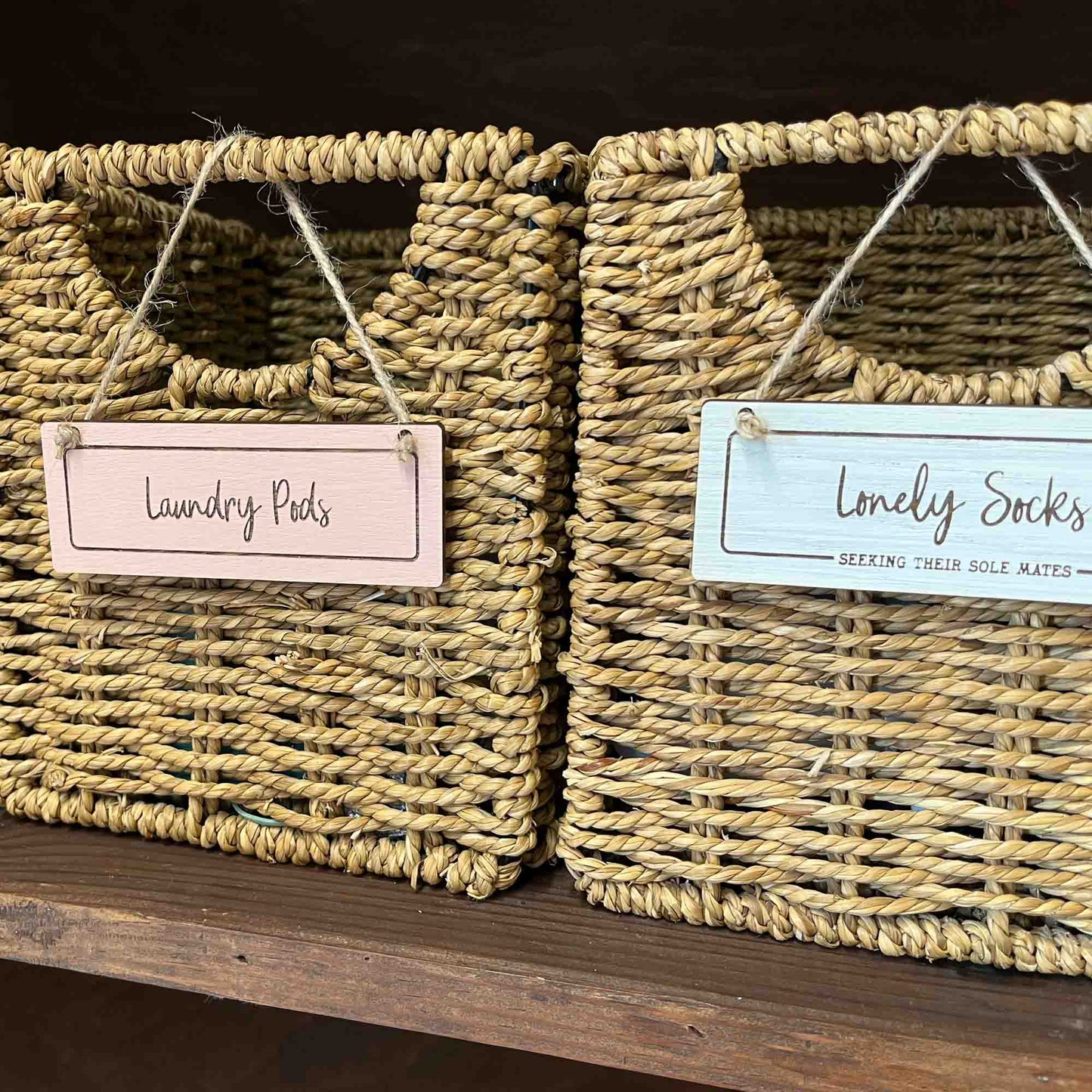 mini signs hanging on storage baskets